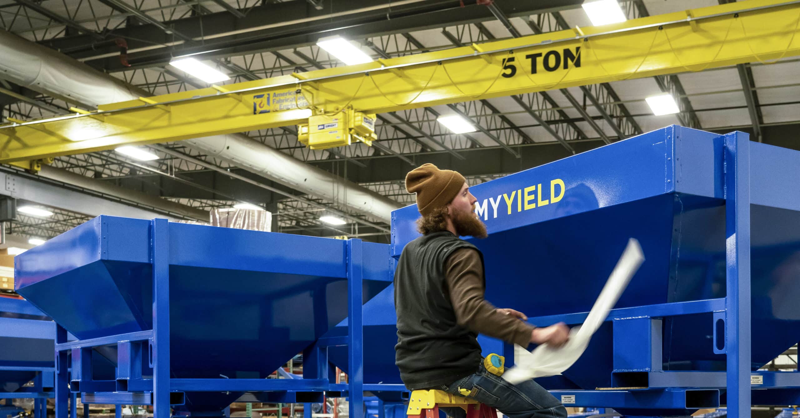 Worker in front of My Yield seed treaters